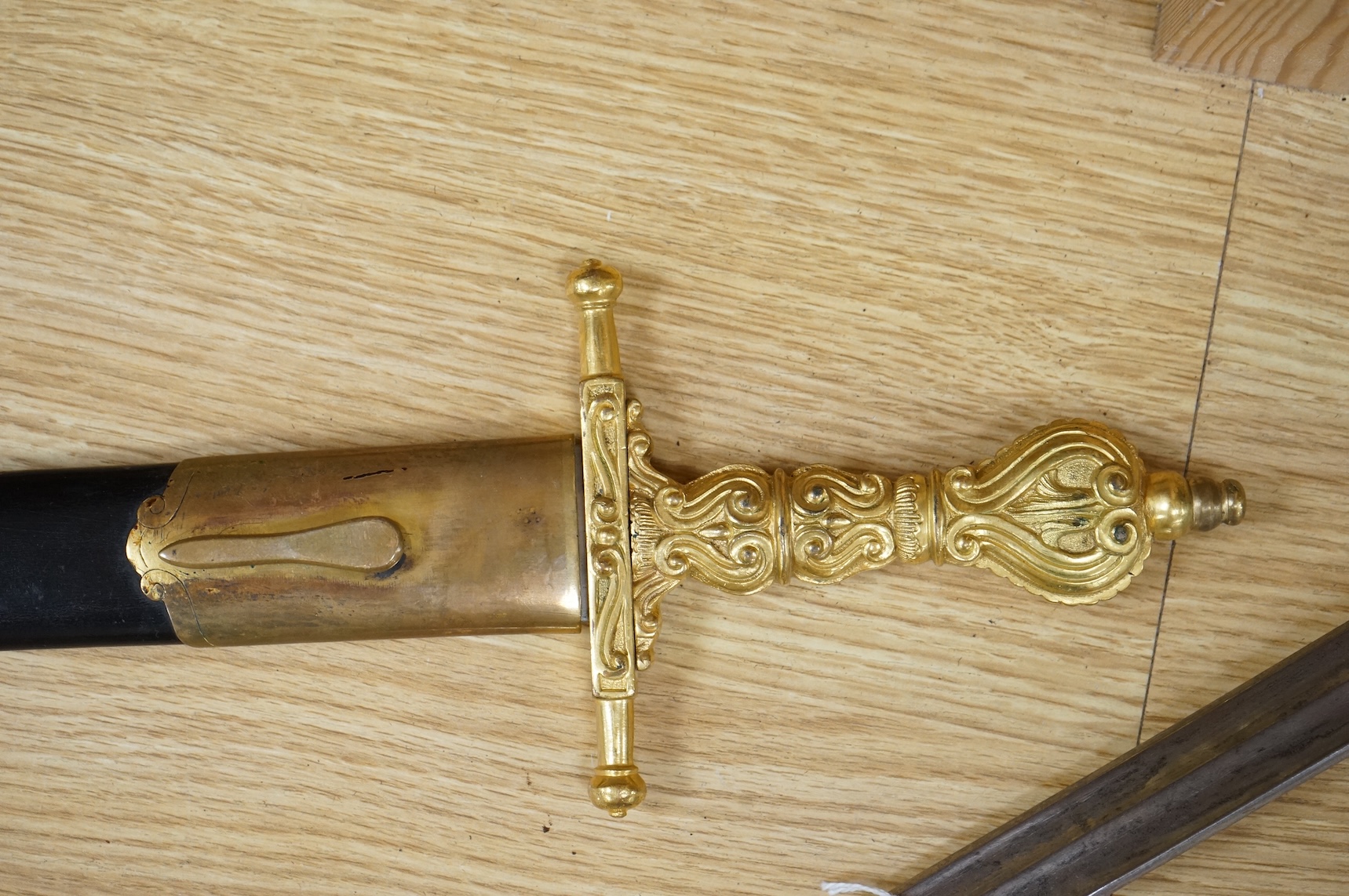 A Scottish sidearm for the King’s Own Bodyguard for Scotland, straight blade by J. Stewart and Son, etched and polished regulation blade, ormolu hilt, in its leather scabbard with ormolu mounts (gilding worn to mounts)